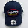 A navy blue baseball cap featuring an embroidered oval logo on the front that reads 'hot VWs magazine' in white and yellow with a red border. A silver metal size tag for an Otto 7-7/8 low profile cap is attached to the brim.